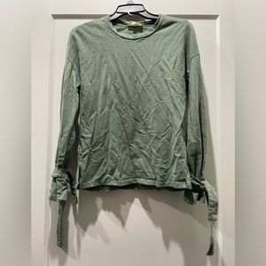 Green long sleeve with decorative arm ties